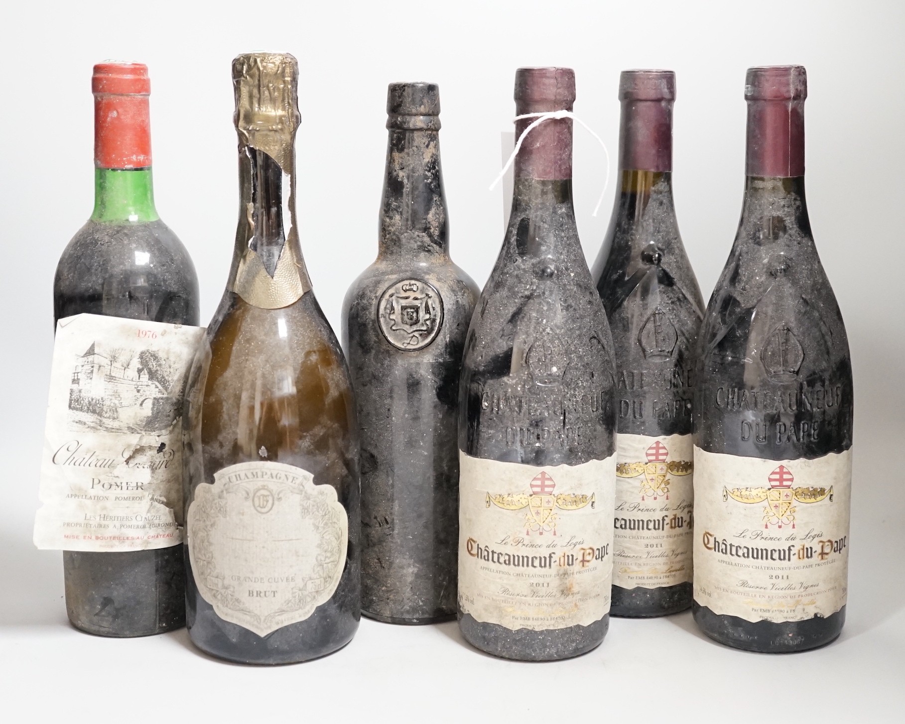 Three bottles of Chateauneuf-du-pape, One bottle of Pomerol, one bottle of port and one bottle of champagne